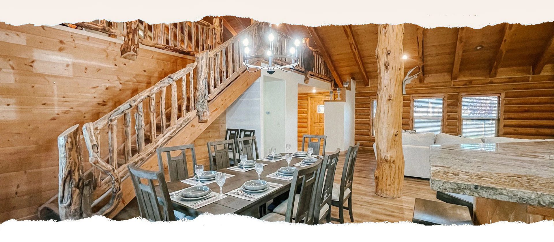 A photo of a dining room in a log cabin.